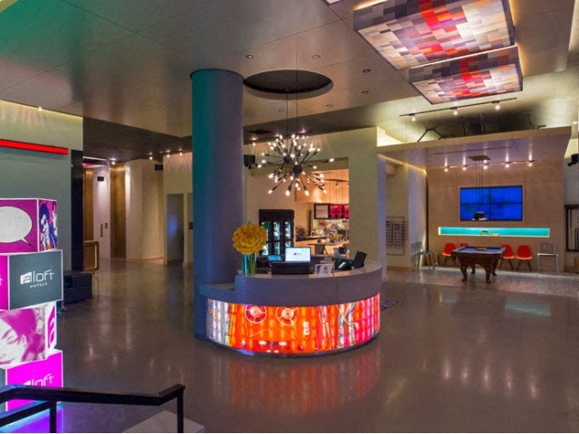 the lobby of a building with a reception desk