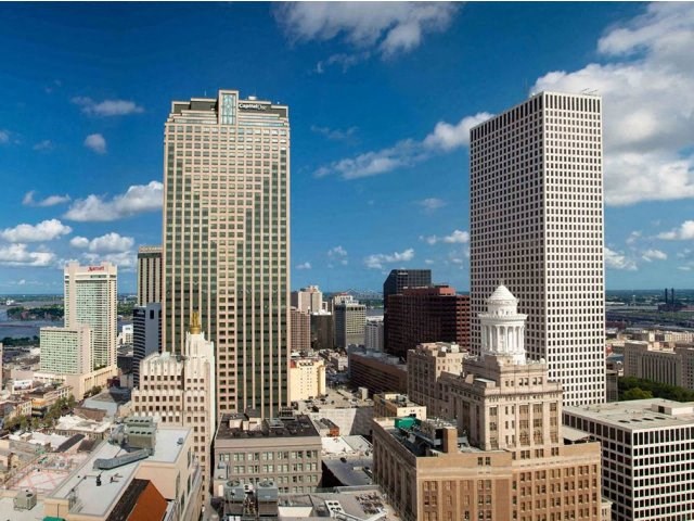 a view of the skyline of a city with tall buildings