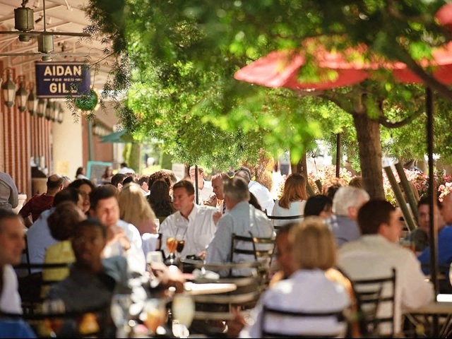 a large group of people sitting at tables