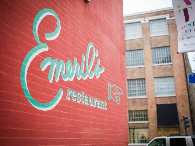 a sign on the side of a red brick building