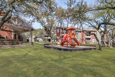 Tot Lot And Playing Field at Wildwood Apartments, CLEAR Property Management, Austin, 78752