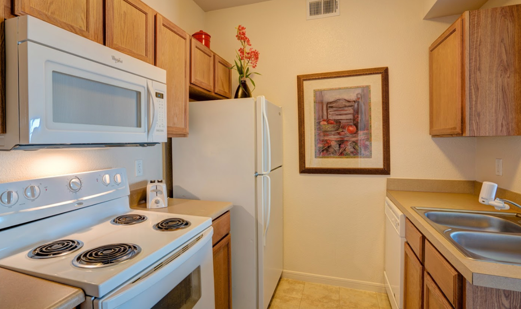 a kitchen with a stove microwave and refrigerator