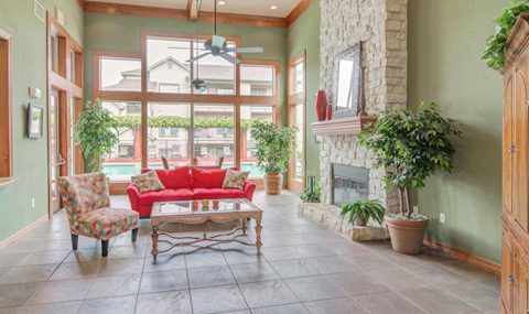 a large living room with a couch and a fireplace