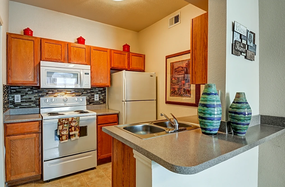 a kitchen with stainless steel appliances and a counter top