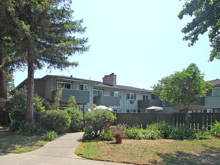 a house with a sidewalk in front of it