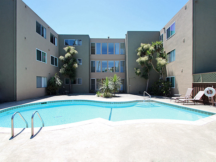 an apartment building with a swimming pool