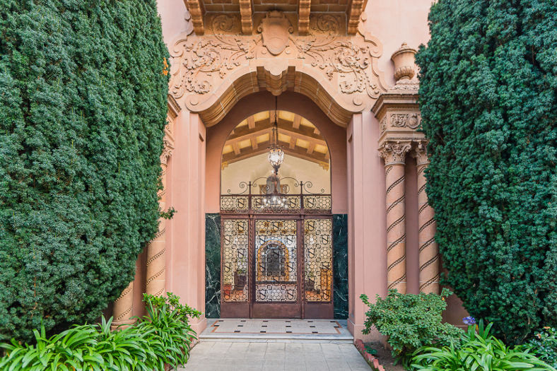 the entrance to a building with a bronze door