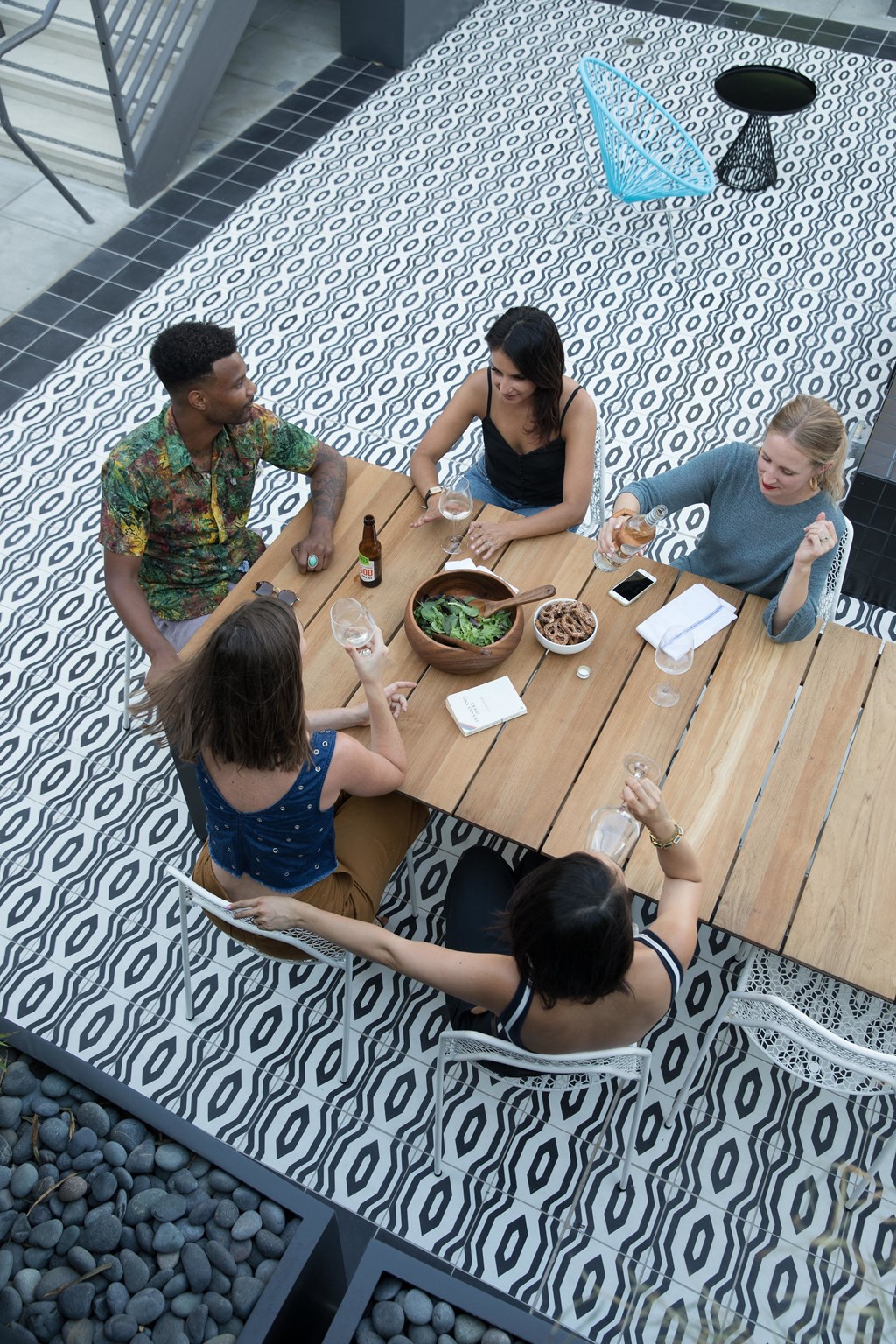 a group of people sitting around a wooden table