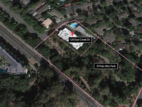 a map of the site with a road and a parking lot