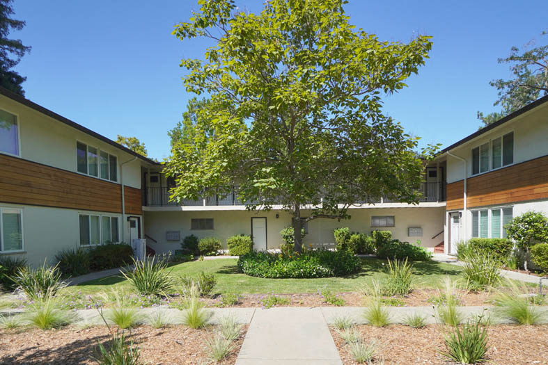 a courtyard in the middle of an apartment building