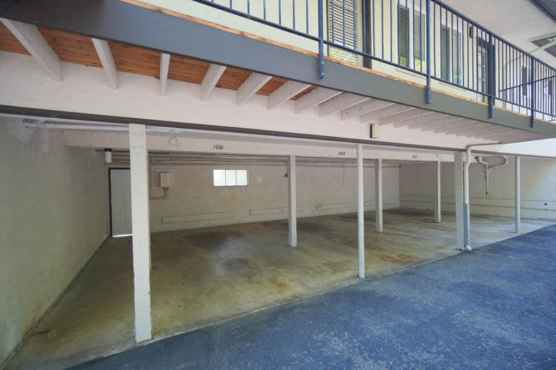 the inside of a building with a garage and a staircase