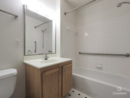 a bathroom with a sink and a tub and a mirror