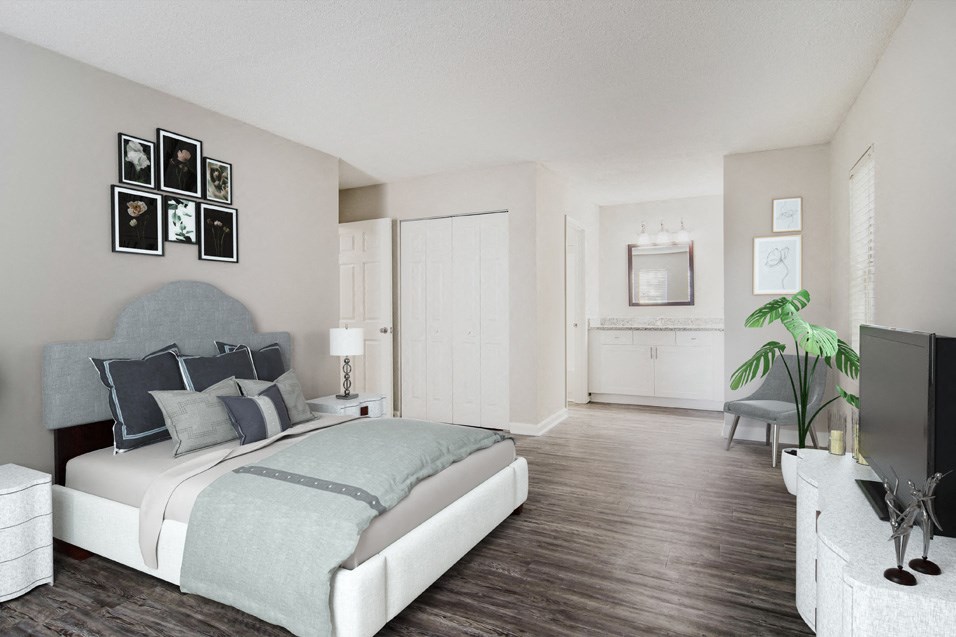 a bedroom with a bed and a chair in a room