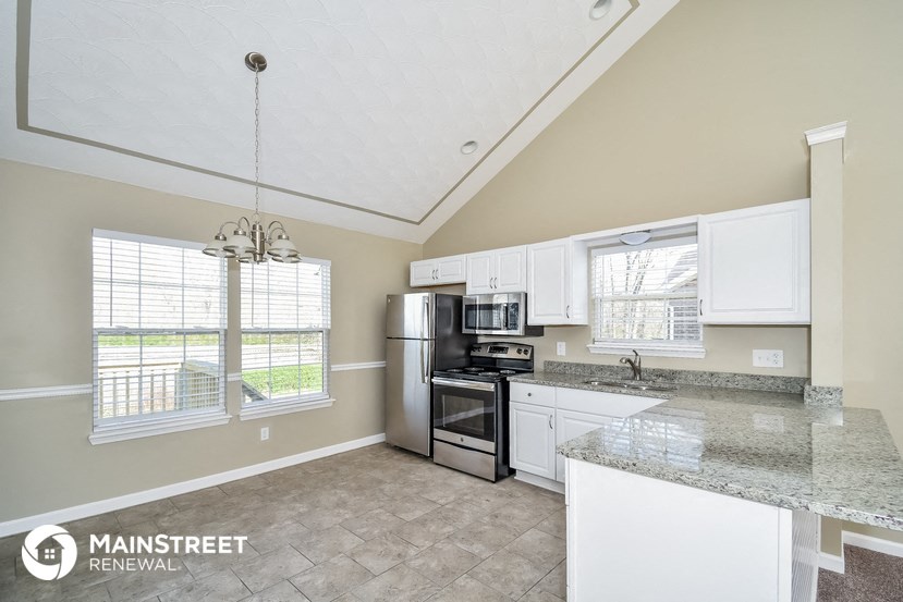 the kitchen is clean and ready to use with stainless steel appliances