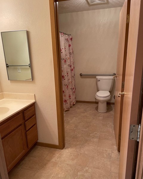 a bathroom with a toilet and a sink