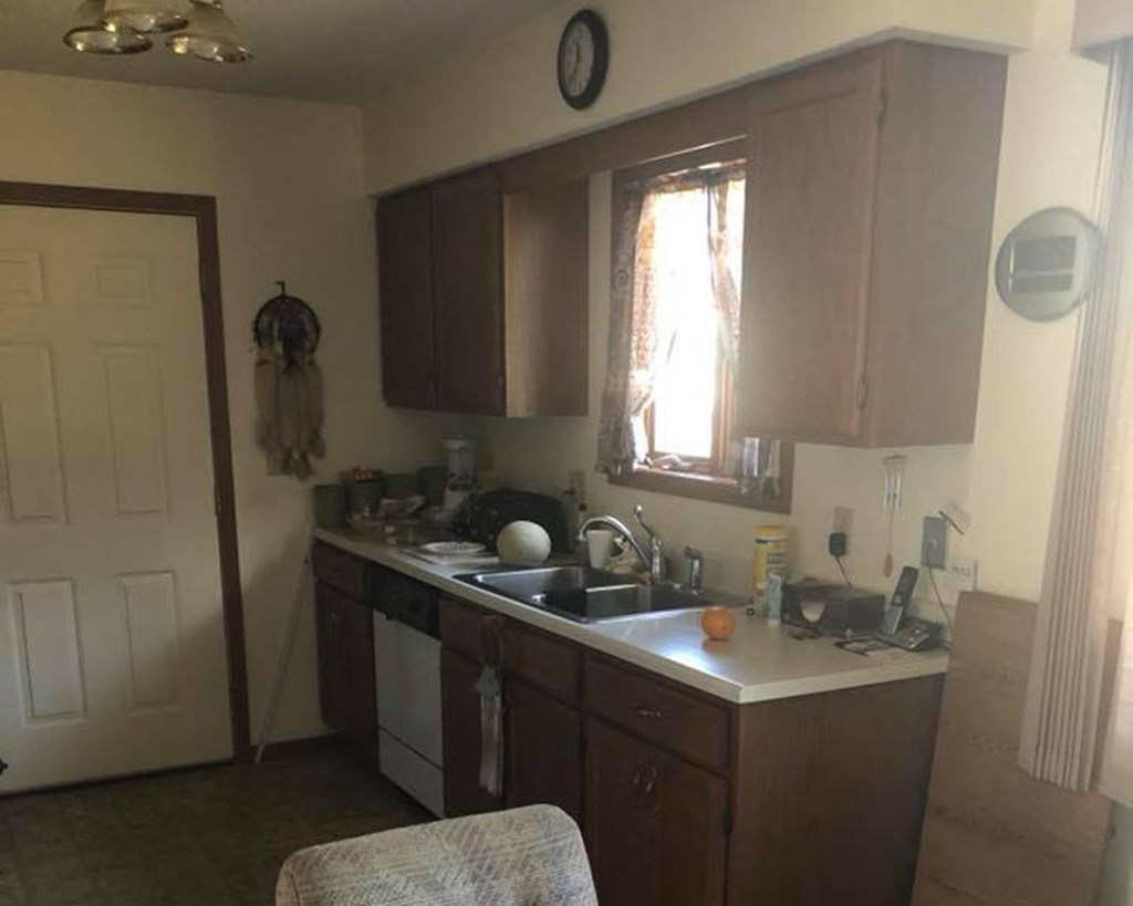 a kitchen with a sink and a window