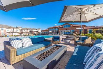 Pool side seating with fire pit
