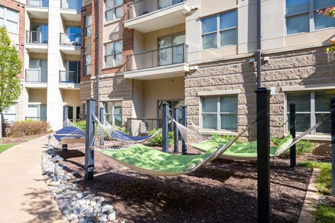 a hammock area outside of an apartment building