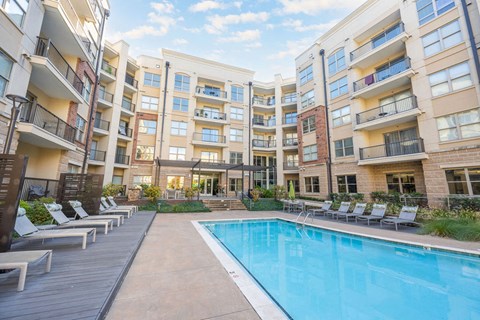 a swimming pool in the middle of an apartment building