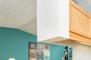 a kitchen with a sink and a refrigerator