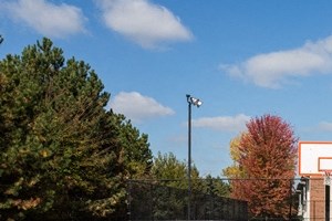 a basketball court in front of a building