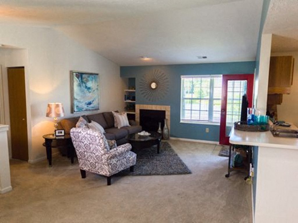 a living room with a couch and a chair