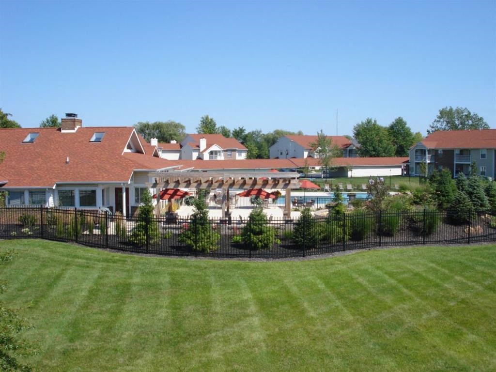 a view of the clubhouse and pool at the resort