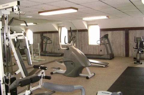 a gym with a lot of equipment in it
