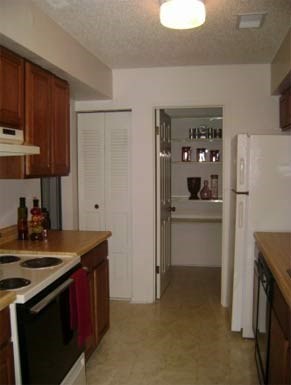 a kitchen with a stove and a refrigerator