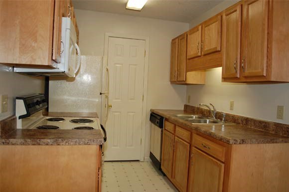 a kitchen with a stove and a sink
