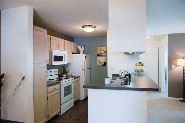 a kitchen with a stove and a sink