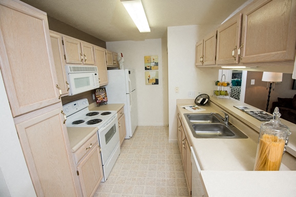 a kitchen with a stove and a sink