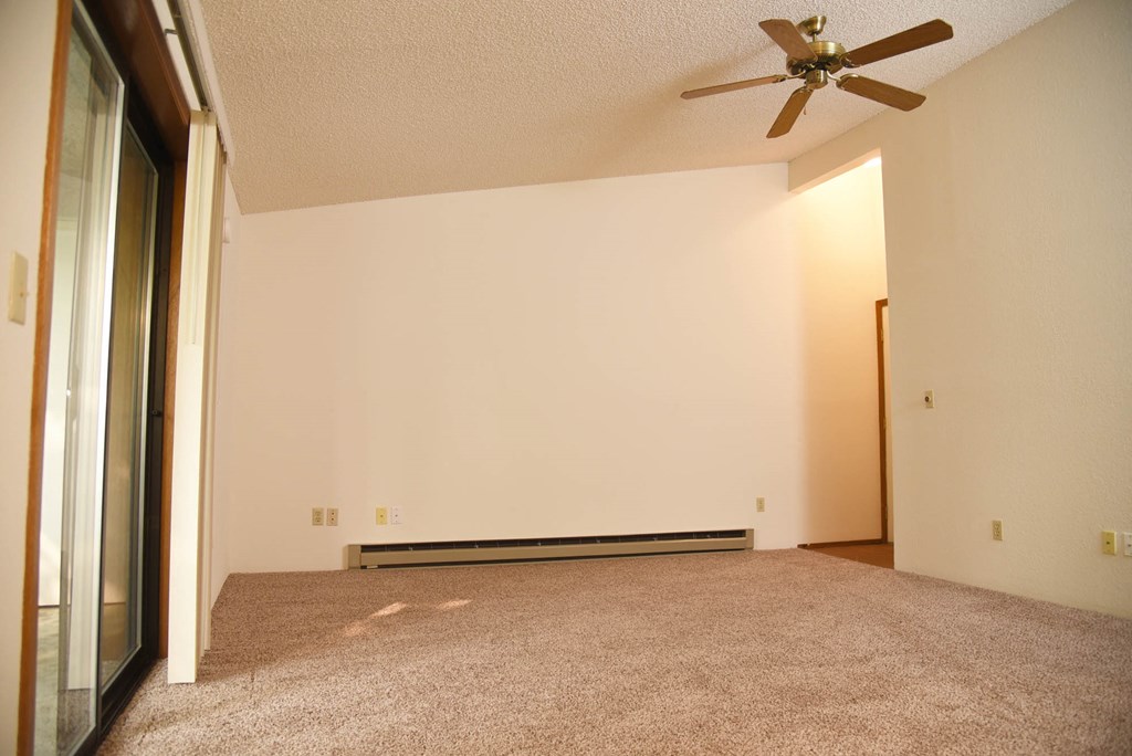 Carpeted Living Space at Parc Grand Apartments, Spokane, WA