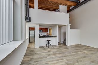 a view of the kitchen and living room from the loft