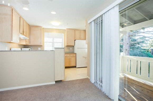 Sliding glass door off the dining area, leading to patio