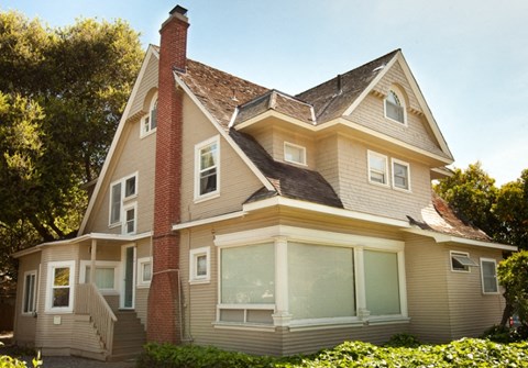 a house with a large roof and a large window