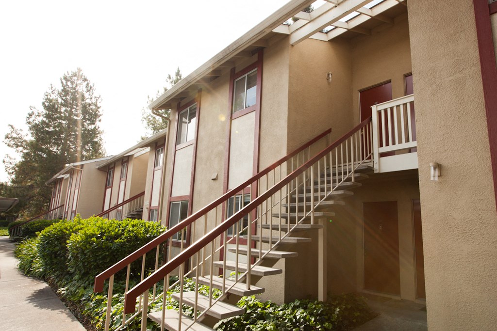 a staircase leading up to an apartment building