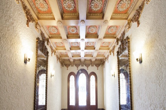 the inside of a large room with windows and a ceiling