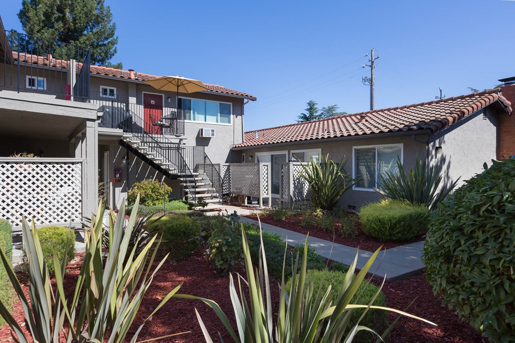 a view of a building at the whispering winds apartments in pearland, tx