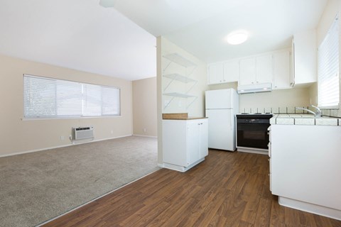 a kitchen and living room in a 555 waverly unit