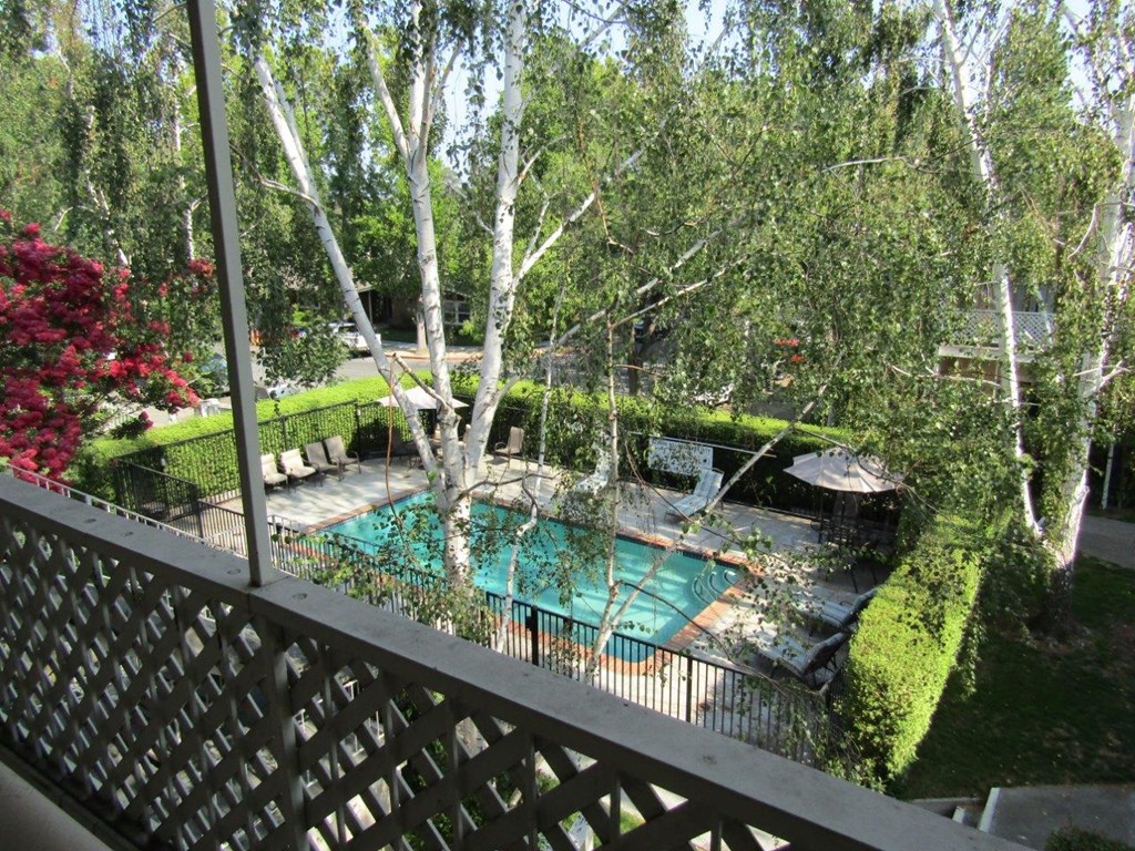 a view of the pool from a balcony