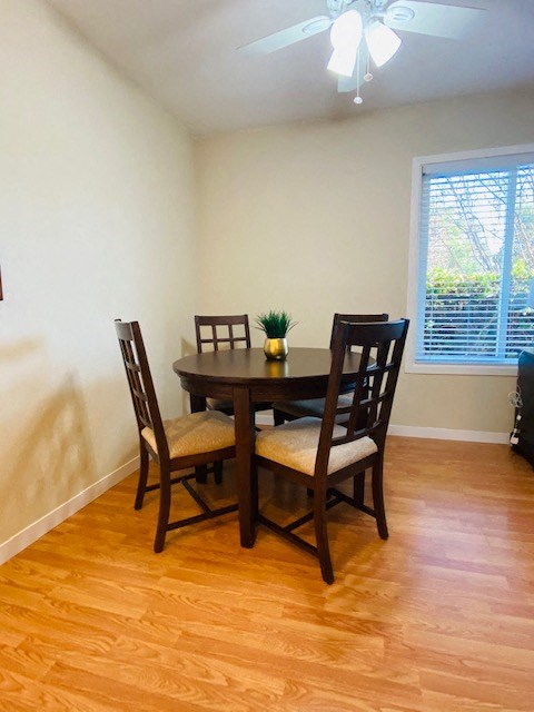 a dining room with a table and chairs