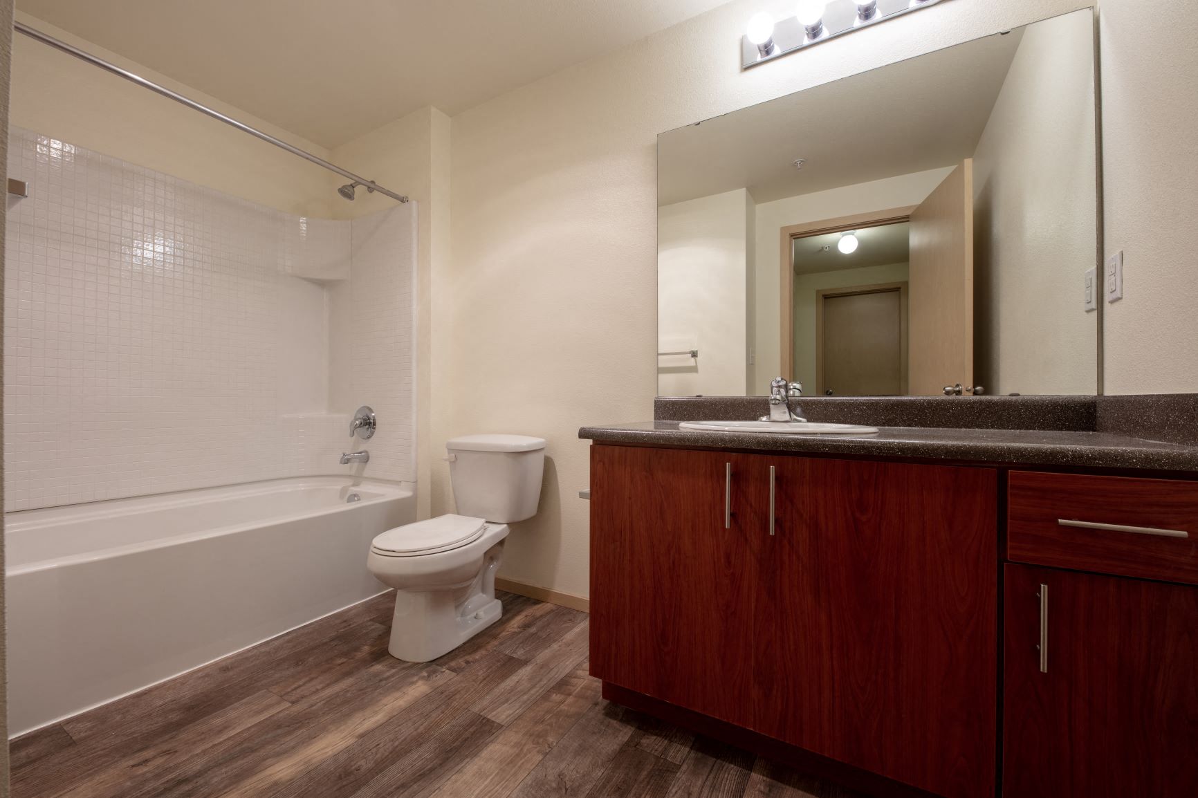 a bathroom with a sink toilet and a mirror