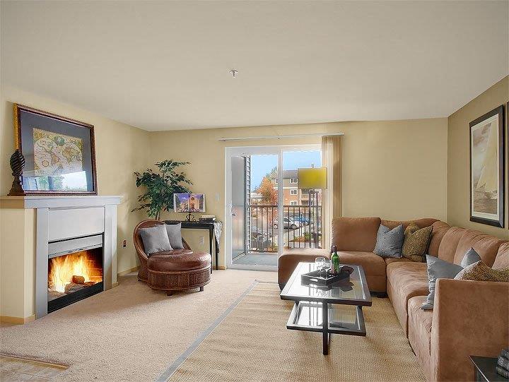 a living room with a fireplace and a couch