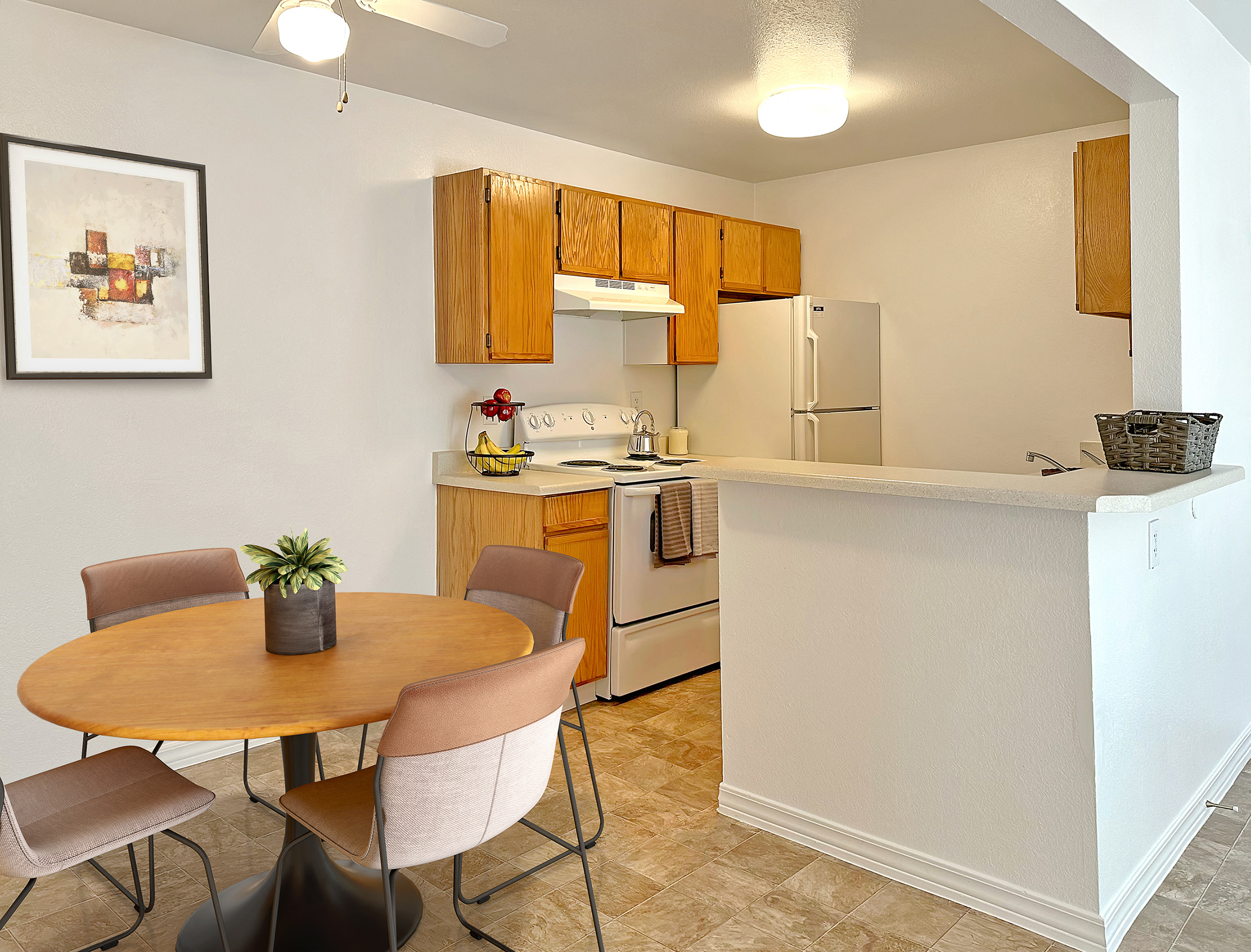 a kitchen and dining area with a table and chairs