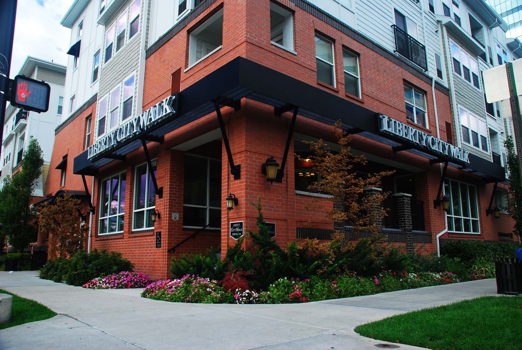 the exterior of a building with a sidewalk in front of it