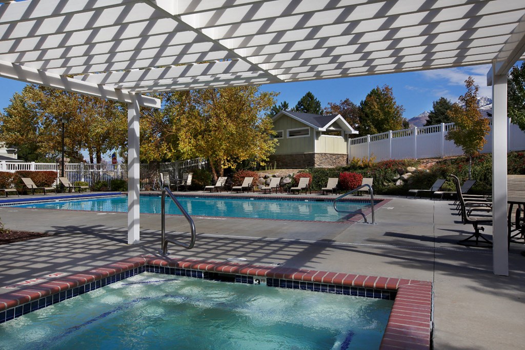 Liberty Hill Apartments, Draper, Utah, pool under a white canopy with trees in the background.