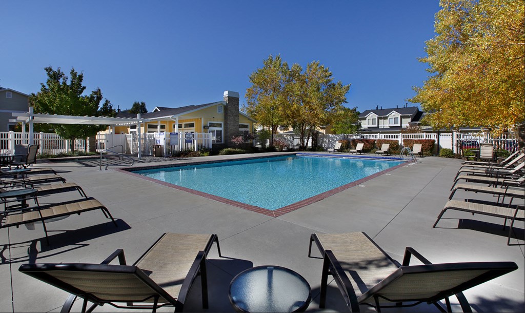 Liberty Hill Apartments, Draper, Utah, pool surrounded by chairs and trees.