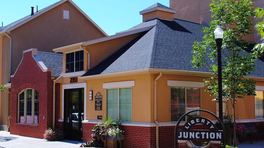 a restaurant with a sign in front of a building
