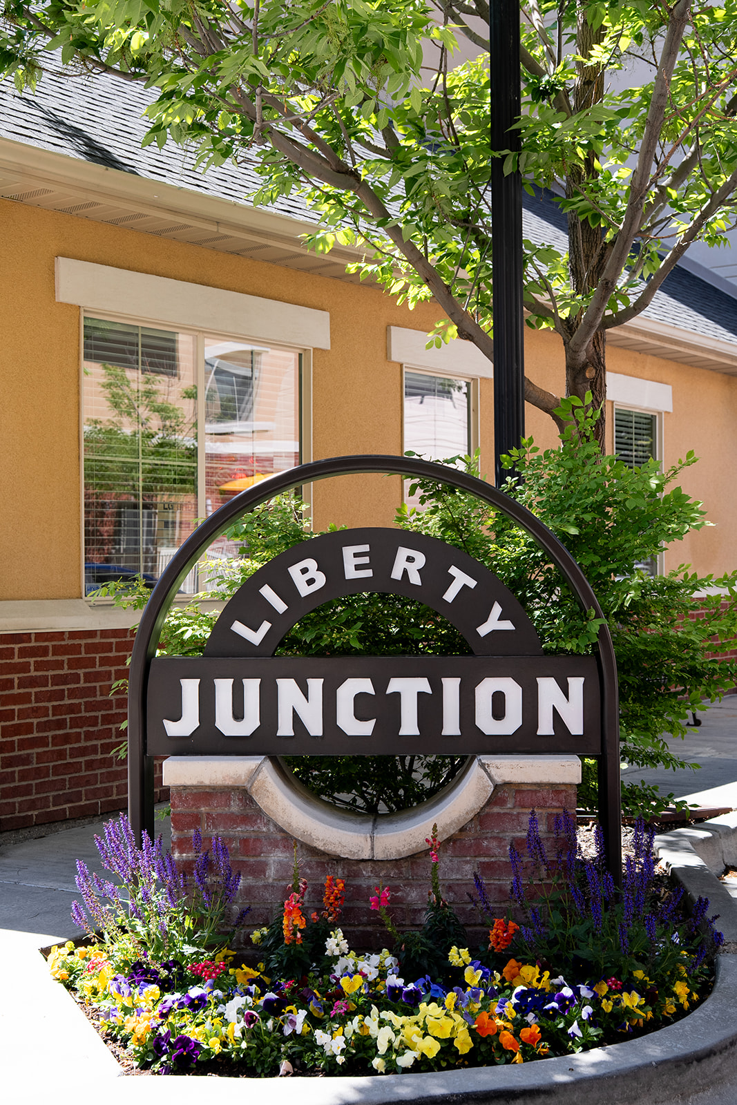 A sign that says Liberty Junction is in front of a building.